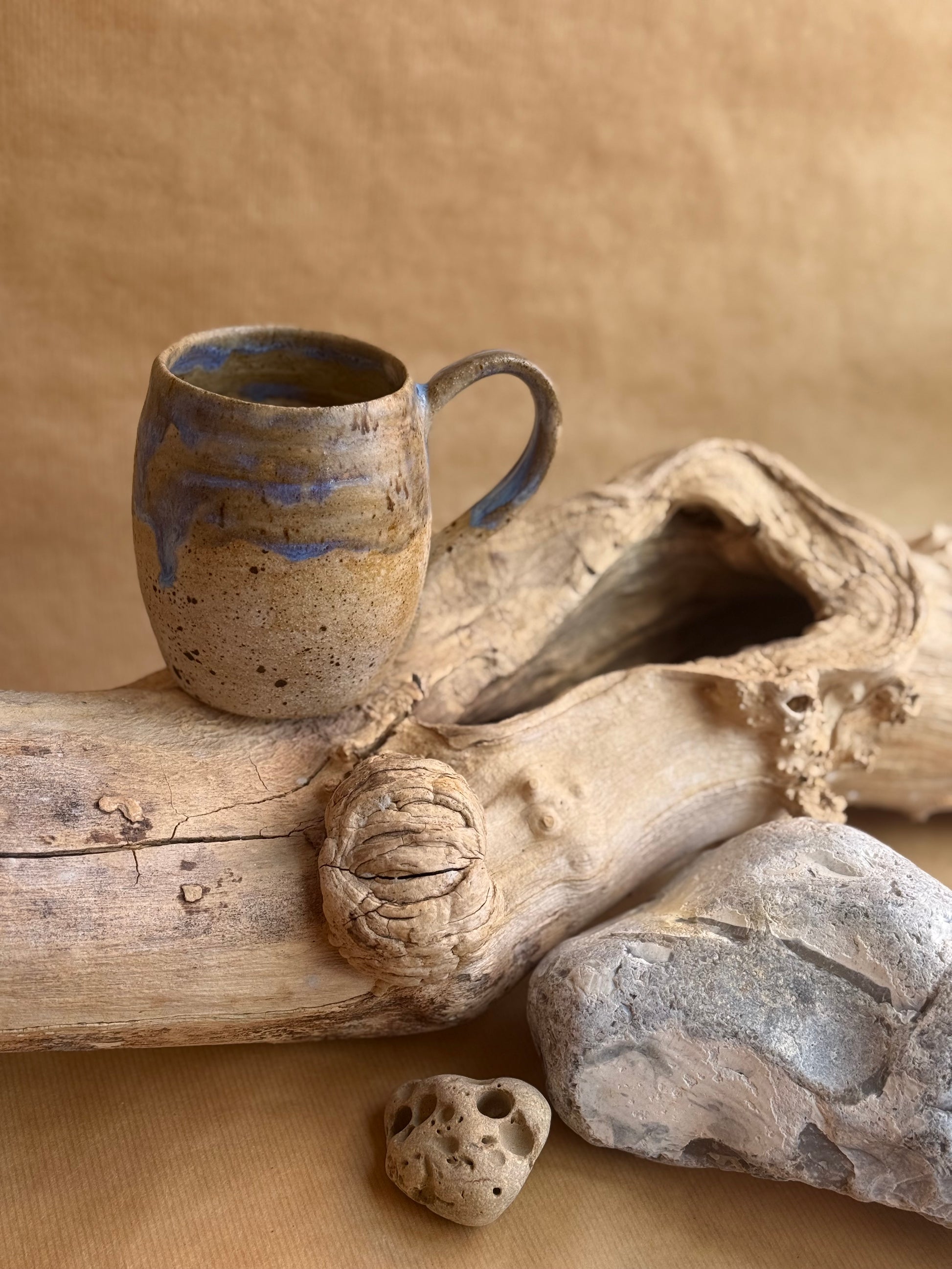 A coastal beach themed mug back view